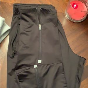 Never worn. Pockets and zippers on the legs